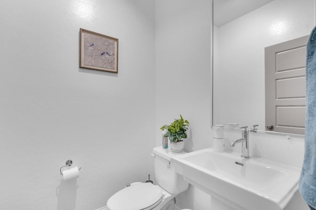 6569 E Lyell Ave, Fresno, CA 93727 - half bathroom featuring a sink and toilet