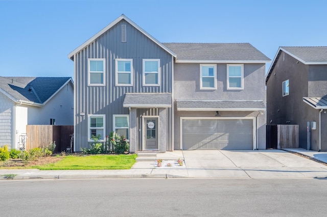 6569 E Lyell Ave, Fresno, CA 93727 - traditional-style house with driveway, an attached garage, and board and batten siding