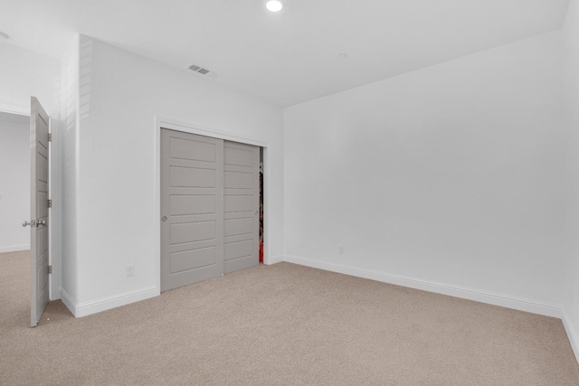 6569 E Lyell Ave, Fresno, CA 93727 - unfurnished bedroom with light colored carpet, a closet, and recessed lighting