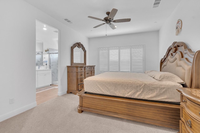 6569 E Lyell Ave, Fresno, CA 93727 - bedroom with light colored carpet, ensuite bath, and a ceiling fan