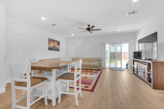 6569 E Lyell Ave, Fresno, CA 93727 - dining room with light wood-style floors, a ceiling fan, and recessed lighting
