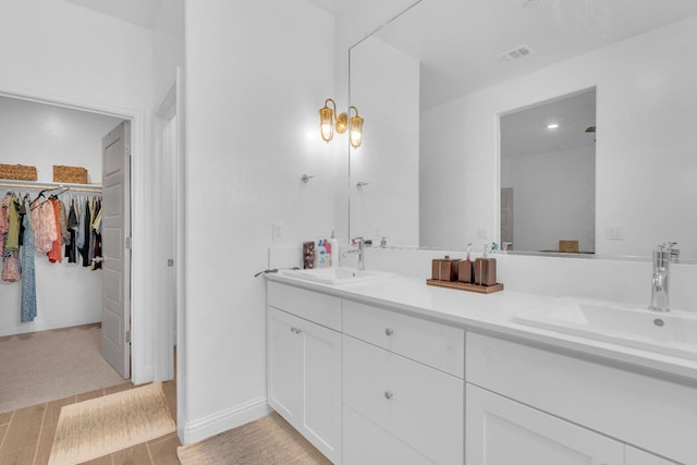 6569 E Lyell Ave, Fresno, CA 93727 - full bathroom featuring double vanity and a spacious closet