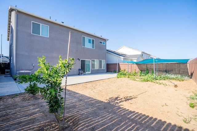 6569 E Lyell Ave, Fresno, CA 93727 - rear view of property with a patio area, a fenced backyard, and stucco siding