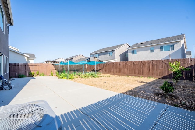 6569 E Lyell Ave, Fresno, CA 93727 - fenced backyard featuring a patio and a residential view