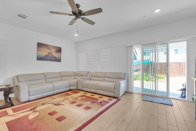 6569 E Lyell Ave, Fresno, CA 93727 - living room featuring ceiling fan, light wood-type flooring, and recessed lighting