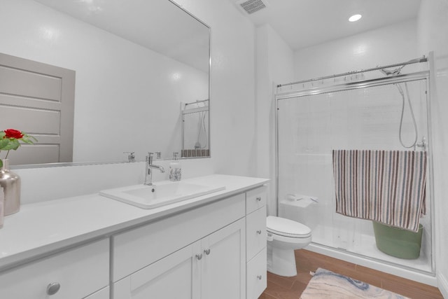 6569 E Lyell Ave, Fresno, CA 93727 - bathroom featuring vanity, a shower stall, and wood finished floors