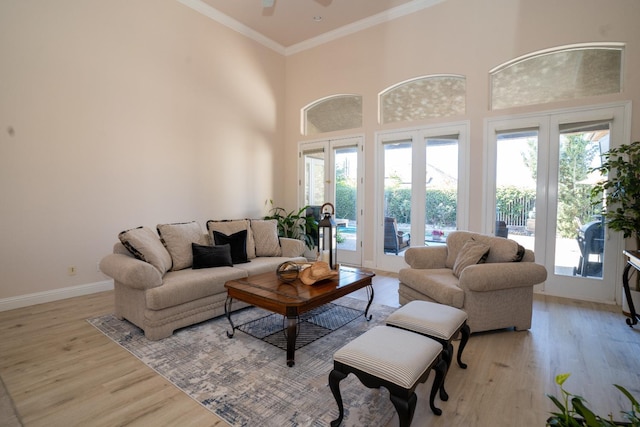 1622 E Shadow Crk, Fresno, CA 93730 - living area featuring light wood-type flooring, ceiling fan, and ornamental molding