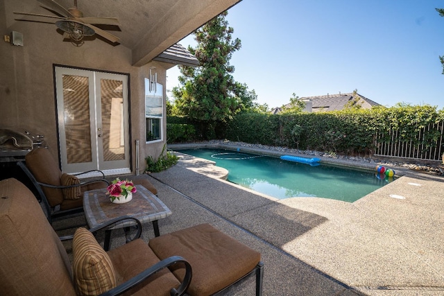 1622 E Shadow Crk, Fresno, CA 93730 - view of pool featuring a patio area, a fenced backyard, a ceiling fan, and french doors