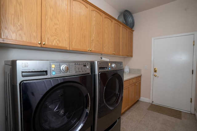 1622 E Shadow Crk, Fresno, CA 93730 - washroom with washer and clothes dryer, cabinet space, and light tile patterned flooring