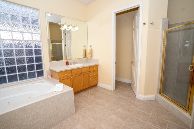 1622 E Shadow Crk, Fresno, CA 93730 - full bathroom with a stall shower, vanity, and a whirlpool tub