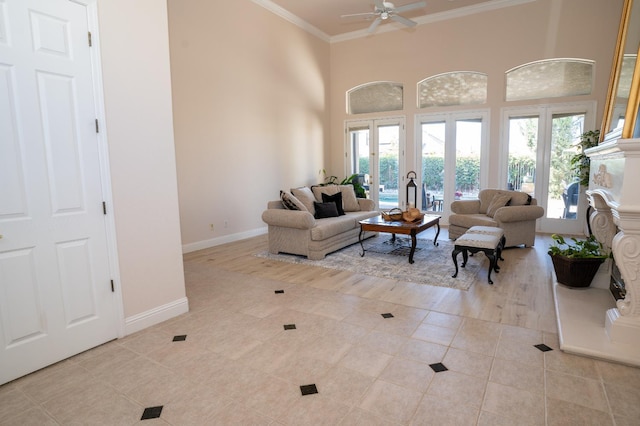 1622 E Shadow Crk, Fresno, CA 93730 - living room with light tile patterned floors, a ceiling fan, ornamental molding, healthy amount of natural light, and a high ceiling