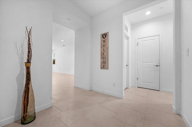 6105 W Richert Ave, Fresno, CA 93723 - corridor with recessed lighting and light tile patterned floors
