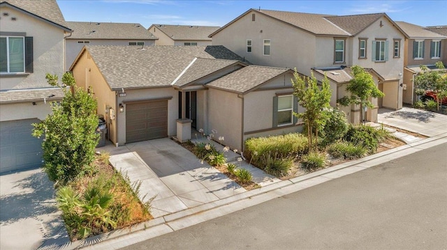 6105 W Richert Ave, Fresno, CA 93723 - multi unit property featuring driveway, stucco siding, and an attached garage