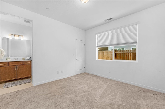 6105 W Richert Ave, Fresno, CA 93723 - unfurnished bedroom with light colored carpet and ensuite bathroom