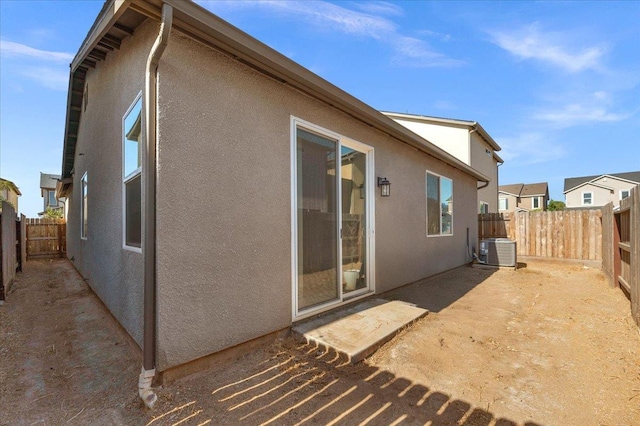 6105 W Richert Ave, Fresno, CA 93723 - back of house featuring stucco siding, a fenced backyard, and a patio area