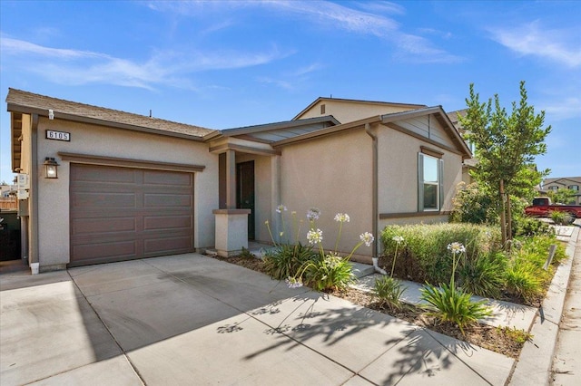 6105 W Richert Ave, Fresno, CA 93723 - single story home with concrete driveway, an attached garage, and stucco siding