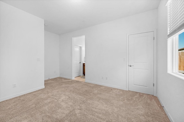 6105 W Richert Ave, Fresno, CA 93723 - unfurnished bedroom featuring light carpet and ensuite bath