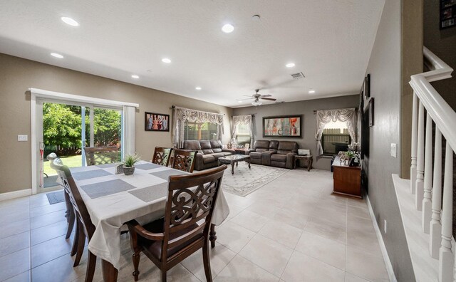 6712 W Lucas Dr, Fresno, CA 93722 - dining room featuring recessed lighting, a ceiling fan, light tile patterned floors, and stairs