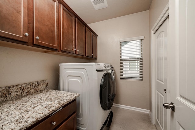 6712 W Lucas Dr, Fresno, CA 93722 - washroom featuring cabinet space and washing machine and clothes dryer
