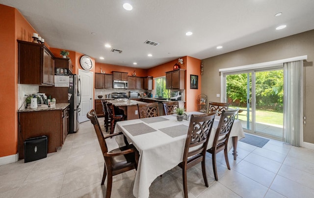 6712 W Lucas Dr, Fresno, CA 93722 - dining space with plenty of natural light, recessed lighting, and light tile patterned floors