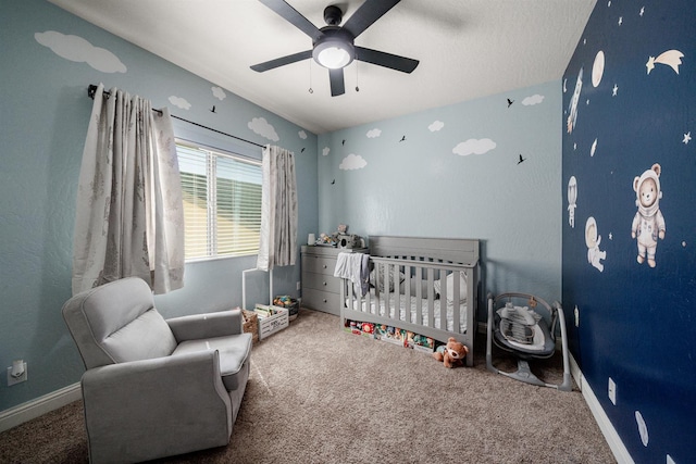 6712 W Lucas Dr, Fresno, CA 93722 - carpeted bedroom with a nursery area and ceiling fan