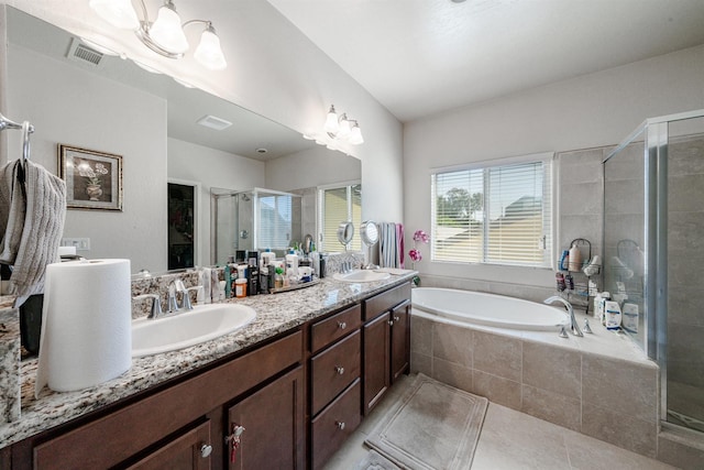 6712 W Lucas Dr, Fresno, CA 93722 - bathroom with a stall shower, double vanity, tile patterned flooring, and a garden tub