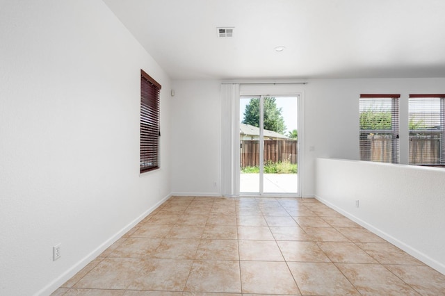 5227 E Florence Ave, Fresno, CA 93727 - empty room with baseboards and light tile patterned floors