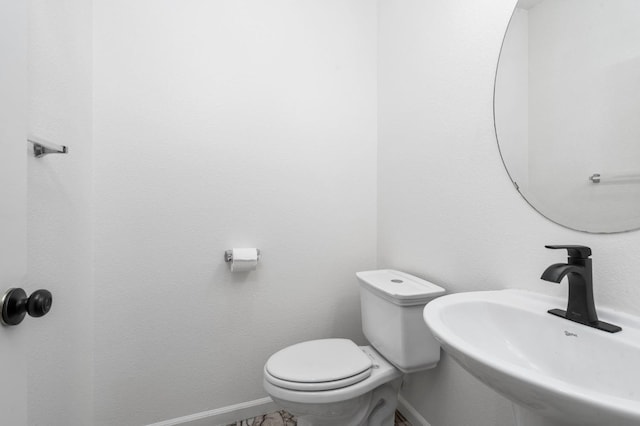 5227 E Florence Ave, Fresno, CA 93727 - half bathroom with a sink and baseboards