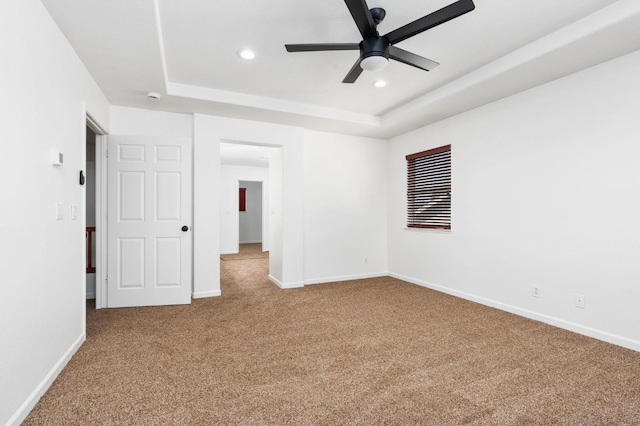 5227 E Florence Ave, Fresno, CA 93727 - unfurnished bedroom with carpet flooring, a tray ceiling, recessed lighting, and a ceiling fan
