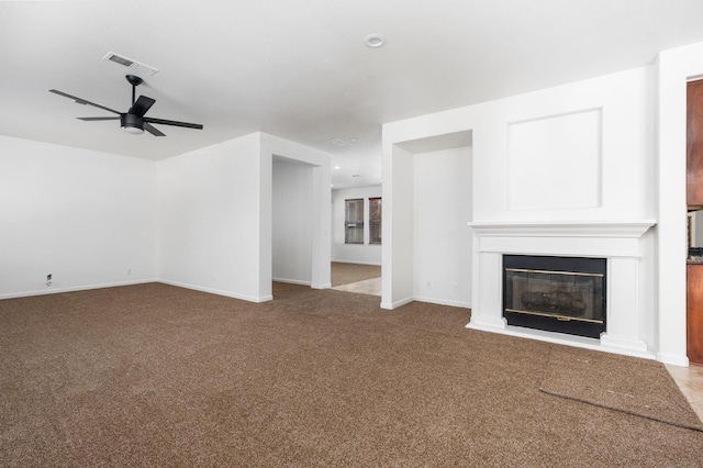 5227 E Florence Ave, Fresno, CA 93727 - unfurnished living room featuring ceiling fan, a glass covered fireplace, carpet, and recessed lighting