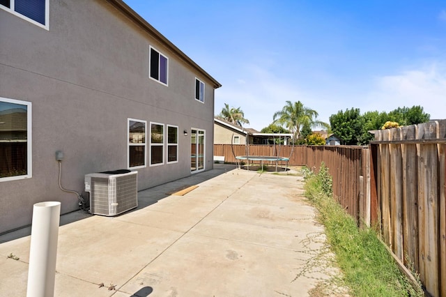 5227 E Florence Ave, Fresno, CA 93727 - fenced backyard featuring a trampoline and a patio area