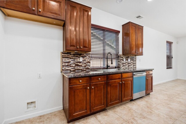 5227 E Florence Ave, Fresno, CA 93727 - kitchen featuring dishwasher, decorative backsplash, dark stone counters, light tile patterned floors, and recessed lighting