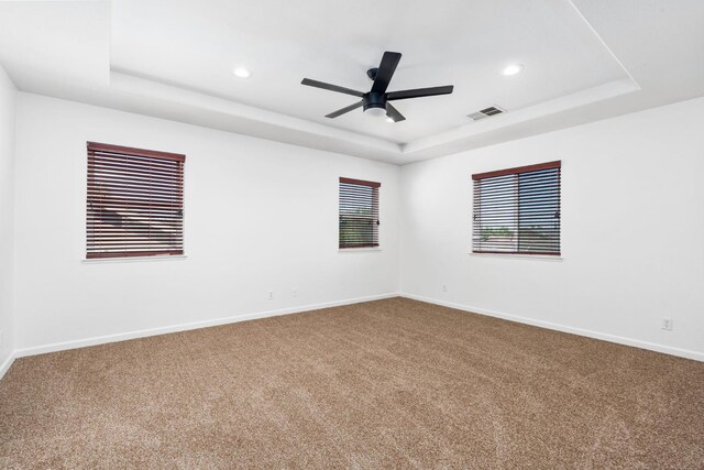 5227 E Florence Ave, Fresno, CA 93727 - spare room featuring a tray ceiling, carpet, ceiling fan, and recessed lighting