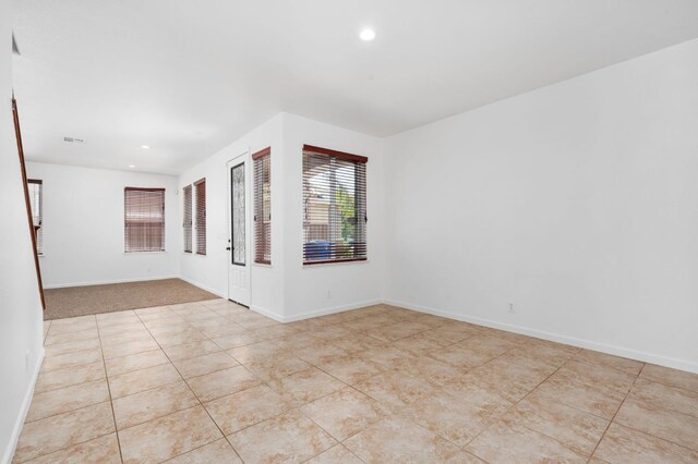 5227 E Florence Ave, Fresno, CA 93727 - spare room with recessed lighting and tile patterned flooring