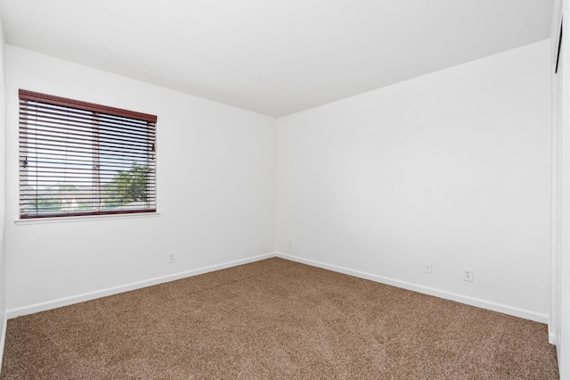 5227 E Florence Ave, Fresno, CA 93727 - carpeted empty room with baseboards
