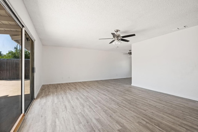 1428 N Knoll Ave, Fresno, CA 93722 - unfurnished room with wood finished floors, a textured ceiling, and ceiling fan
