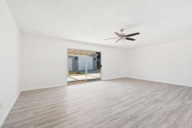 1428 N Knoll Ave, Fresno, CA 93722 - spare room with wood finished floors, a ceiling fan, and a textured ceiling