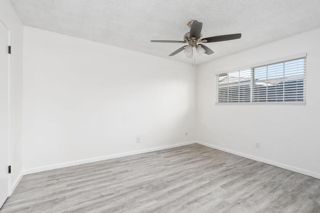 1428 N Knoll Ave, Fresno, CA 93722 - spare room with wood finished floors, a textured ceiling, and ceiling fan