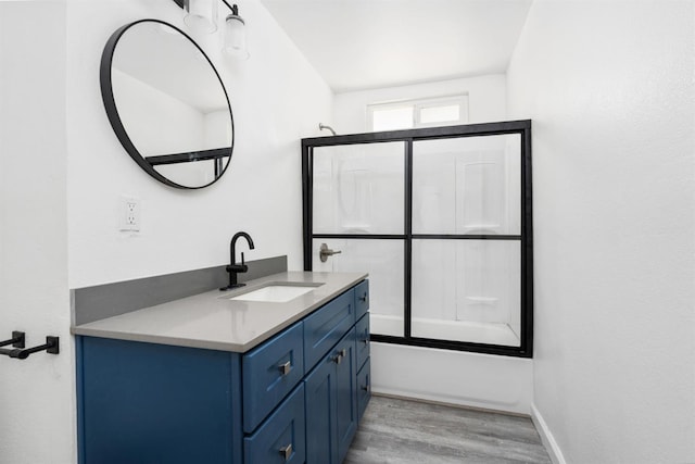 1428 N Knoll Ave, Fresno, CA 93722 - full bath with vanity, wood finished floors, and bathtub / shower combination