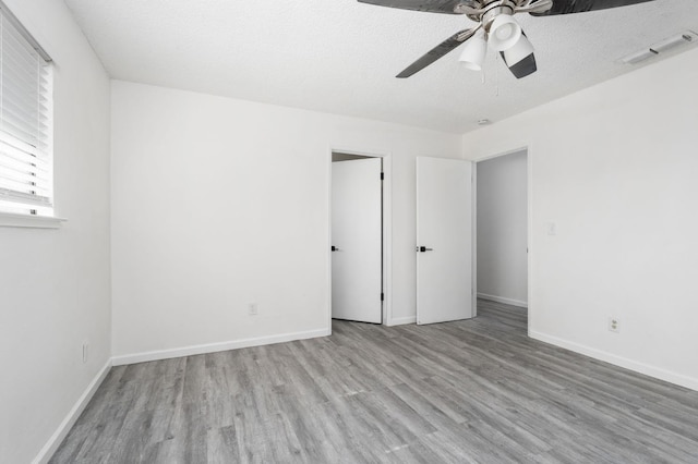 1428 N Knoll Ave, Fresno, CA 93722 - unfurnished bedroom featuring wood finished floors and a ceiling fan