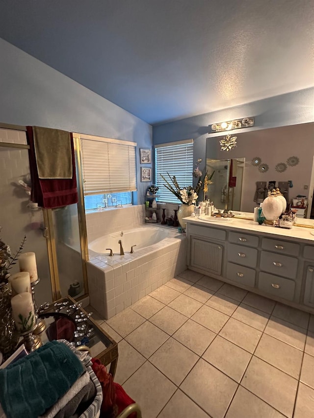 6675 N Lola Ave, Fresno, CA 93722 - bathroom featuring tile patterned flooring, a bath, double vanity, lofted ceiling, and a stall shower