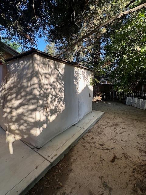 6675 N Lola Ave, Fresno, CA 93722 - view of property exterior with a storage shed