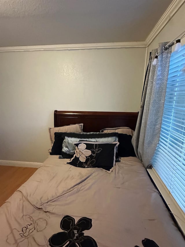 6675 N Lola Ave, Fresno, CA 93722 - bedroom with crown molding and baseboards