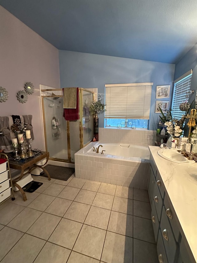 6675 N Lola Ave, Fresno, CA 93722 - full bathroom featuring tile patterned floors, a bath, vanity, and a shower stall