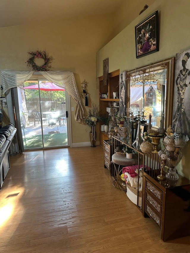 6675 N Lola Ave, Fresno, CA 93722 - dining room with wood finished floors, plenty of natural light, and vaulted ceiling