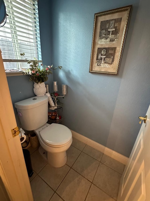 6675 N Lola Ave, Fresno, CA 93722 - bathroom featuring toilet and tile patterned floors