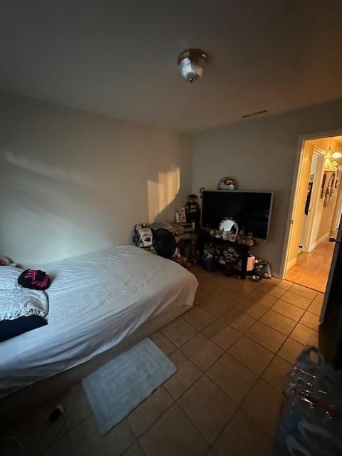 6675 N Lola Ave, Fresno, CA 93722 - bedroom with light tile patterned floors