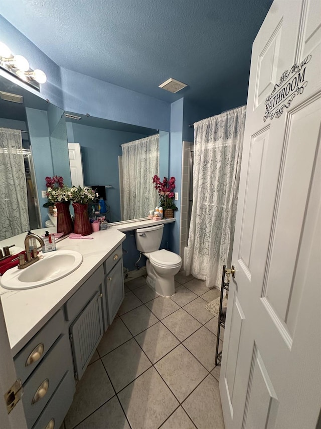 6675 N Lola Ave, Fresno, CA 93722 - bathroom with vanity, tile patterned floors, a textured ceiling, and a shower with shower curtain