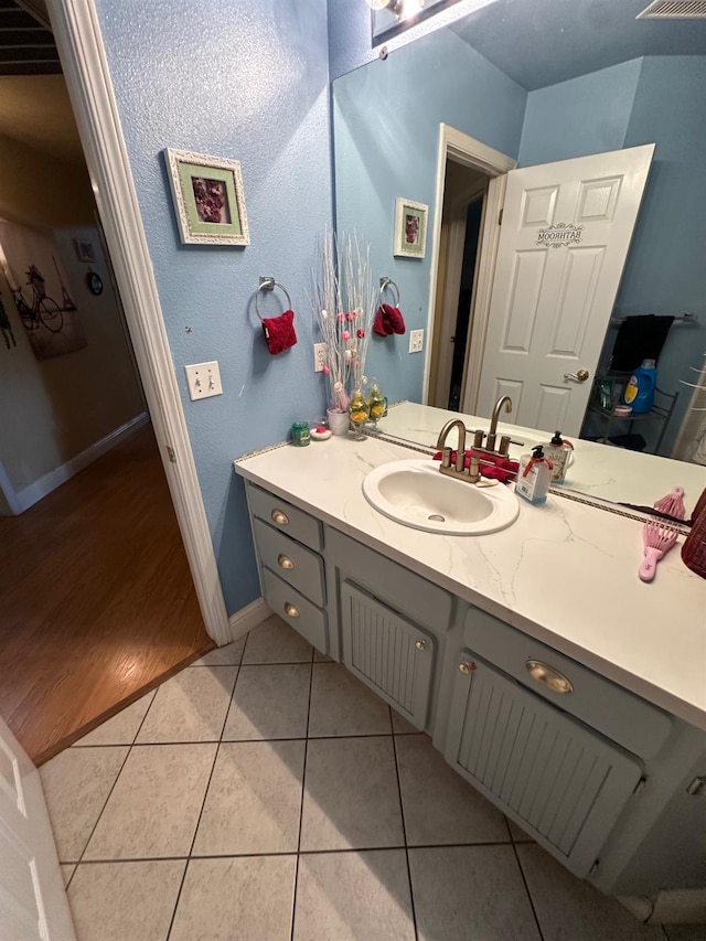 6675 N Lola Ave, Fresno, CA 93722 - bathroom featuring vanity and tile patterned flooring