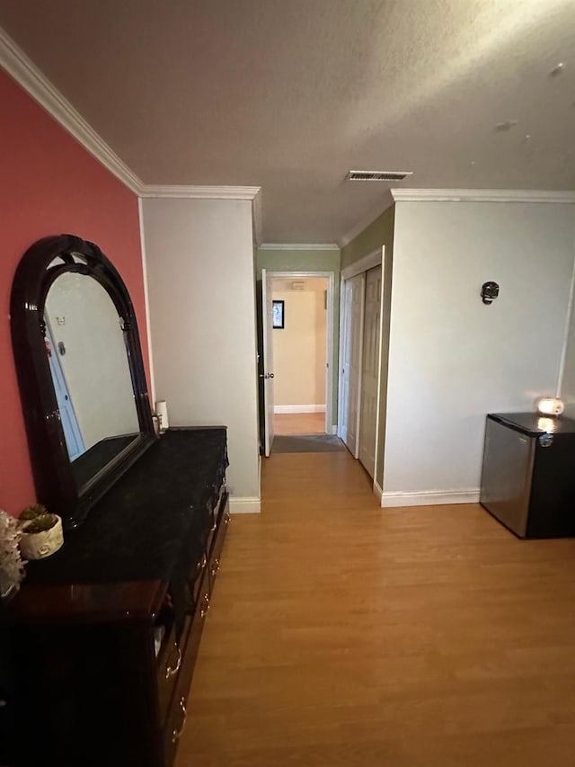 6675 N Lola Ave, Fresno, CA 93722 - hall with light wood finished floors and ornamental molding